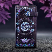 Purse with 'Book of Shadows' design featuring a pentagram and butterfly on a dark background.
