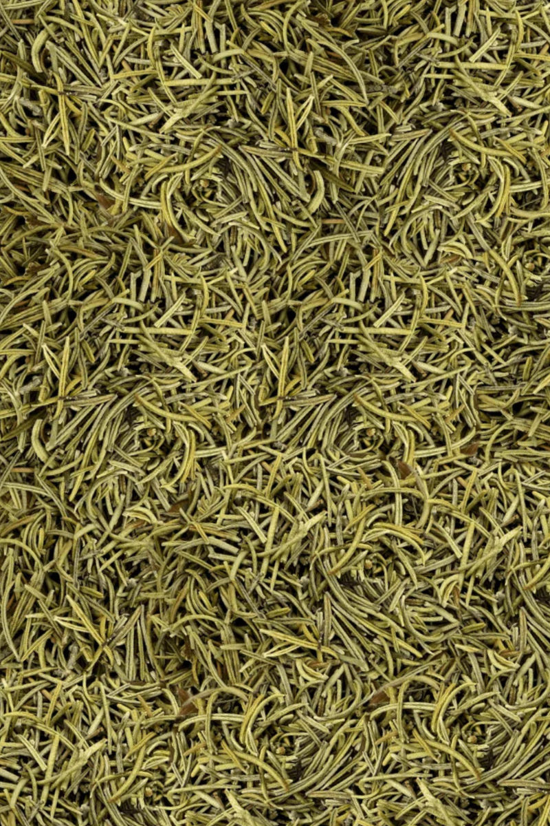 A close-up texture shot of dried green rosemary leaves filling the entire frame.