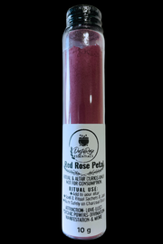 glass bottle of red rose petal powder with white label on black background
